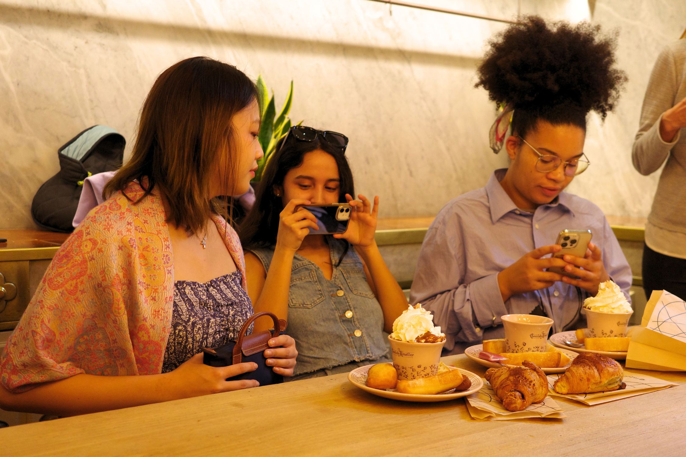 Guests taking photos of the chocolate breakfast in Casa Amatller in Barcelona