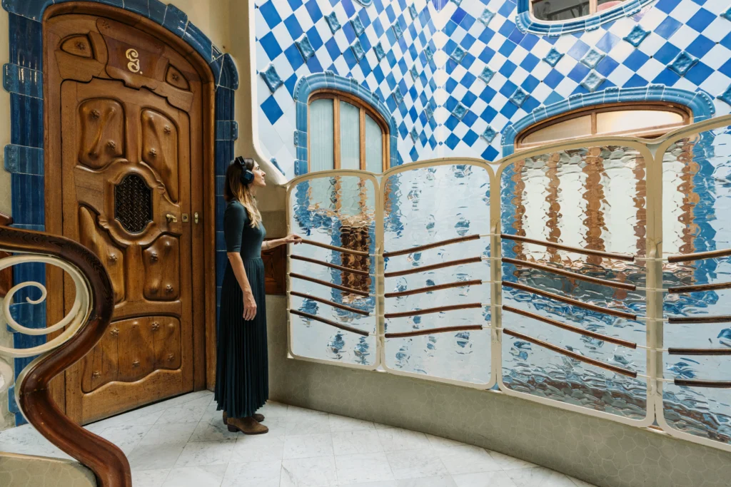 Woman admiring interior of Casa Batllo in Barcelona